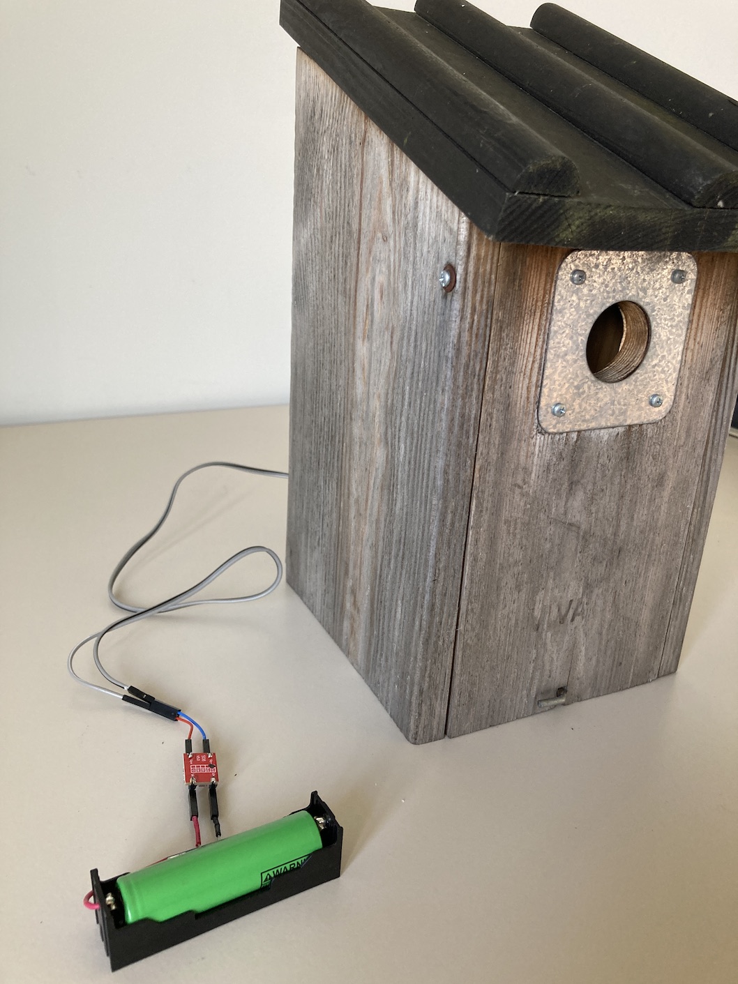 birdhouse and battery